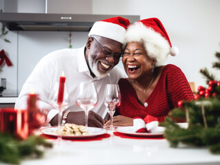 Merry Christmas and Happy Holidays! Cheerful mature African American couple celebrating Christmas at home.