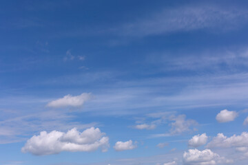 Naklejka na ściany i meble Stratocumulus Clouds on Blue Sky Background.