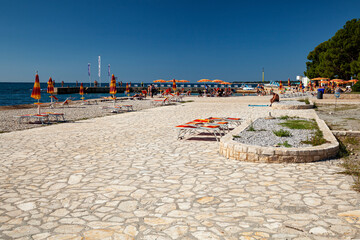 Beach on the stone coast of Spadici, Poreč, Istria, Croatia, Europe