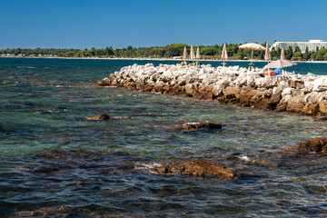 Beach on the stone coast of Spadici, Poreč, Istria, Croatia, Europe