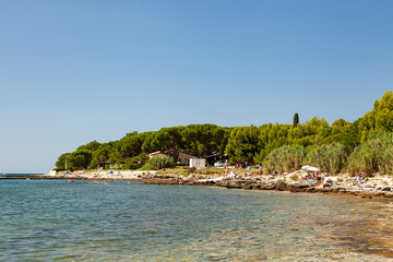 Beach on the stone coast of Beach Kastanija, Novigrad Istria, Croatia, Europe
