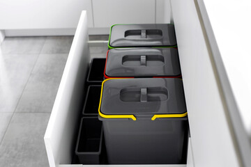 Colorful bins for sorting of plastic, paper garbage and organic waste at home. Modern kitchen with...