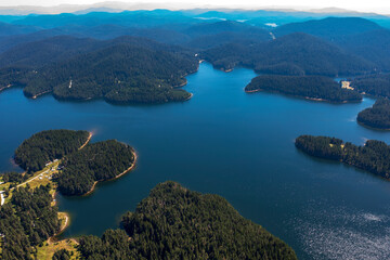 Obraz premium Stunning aerial view at Dam Shiroka Poliana, Bulgaria, Beautiful blue water and green forest.