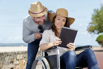 couple in wheelchair looking out to the sea