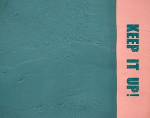 Green copy space background with inscription text KEEP IT UP! message used to encourage someone to...