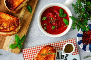 Tomato soup with cheese toast.selective focus
