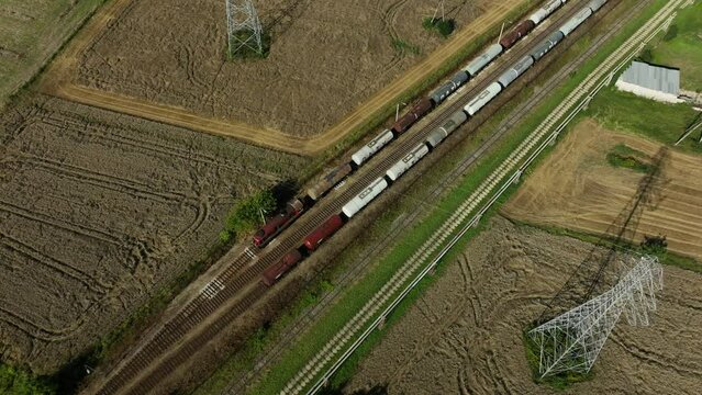 Fuel Transport by Rail - Engaging footage of trains transporting fuel, including gasoline, diesel, oil, and lubricants, ensuring a steady supply to a fuel dispensing facility.