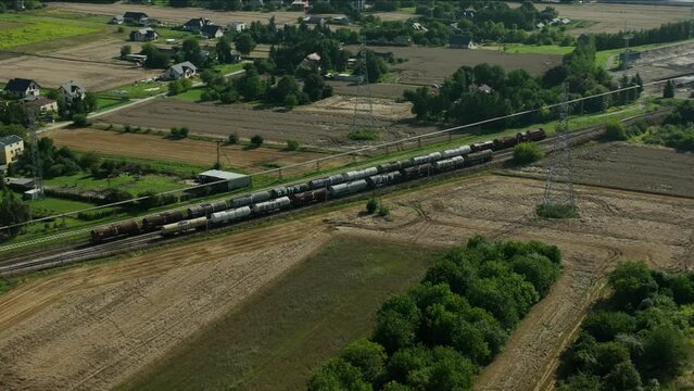 Fuel Transport by Rail - Engaging footage of trains transporting fuel, including gasoline, diesel, oil, and lubricants, ensuring a steady supply to a fuel dispensing facility.