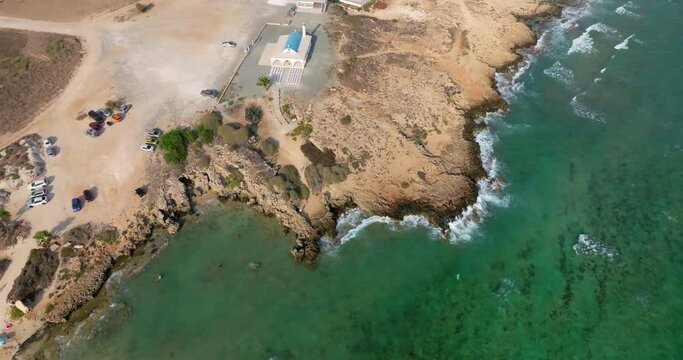 Aerial view of Nissi beach in Ayia Napi, Cyprus. Luke sari rest on the sea with turquoise water waves. High quality 4k footage