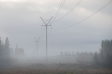 Misty day - Electricity transmission network power lines 