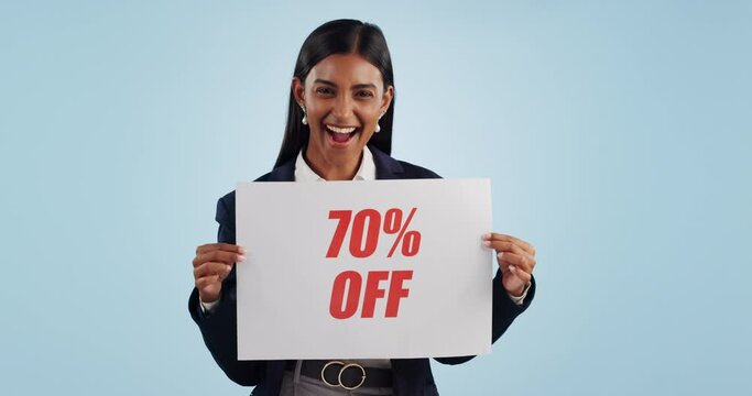 Discount price sign, woman and wow face from shopping deal, promotion and poster in studio. Happy, portrait and smile with sale announcement promo on paper for advertising with blue background