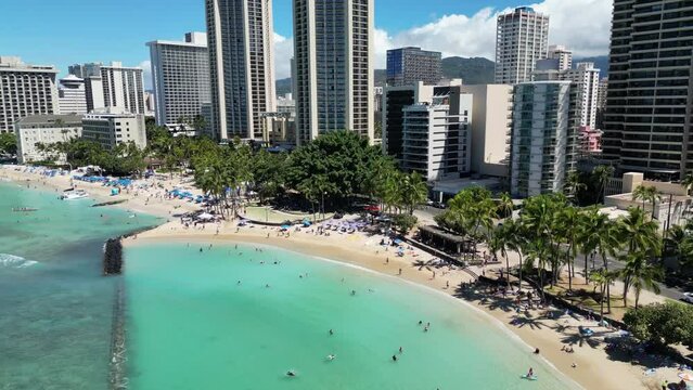Aerial view Hawaiian Islands Honolulu USA. Cityscape with high-rise embankments and sandy beaches in a tropical resort in the Pacific Ocean. High quality 4k footage