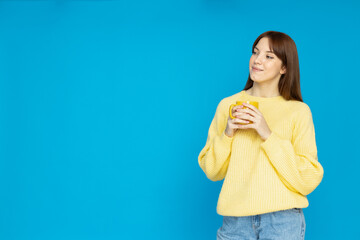 A young girl with a cup in her hands