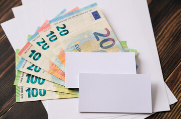 Euro banknotes on sheets of paper