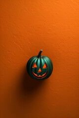 Halloween pumpkin on orange background. Autumn background. Holiday Halloween. Flat lay style, copy space, vertical image.