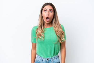 Young Uruguayan woman isolated on white background looking up and with surprised expression