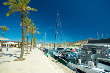 Fototapeta na wymiar Cartagena port, Spain. Boats and promenade