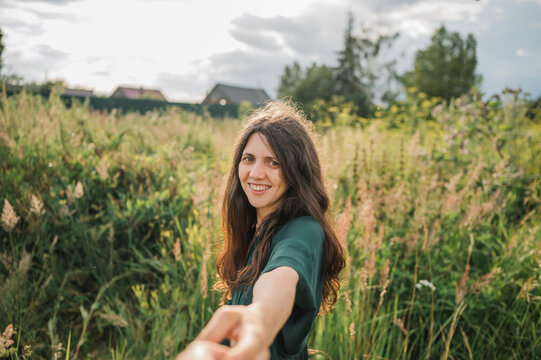 Happy woman spending leisure time in field