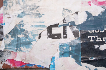 Fototapeta premium Ripped street poster background. Torn abstract and grungy paper backdrop.