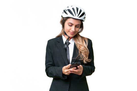 Business Uruguayan woman wearing a helmet biker over isolated background sending a message with the mobile