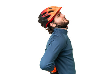 Young cyclist man over isolated chroma key background suffering from backache for having made an effort - obrazy, fototapety, plakaty