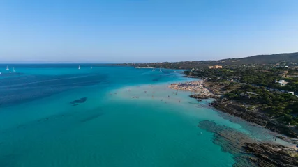 Foto op Plexiglas anti-reflex La Pelosa Strand, Sardinië, Italië Aerial view of La Pelosa beach at sunny summer day. Stintino, Sardinia island, Italy. Drone view of sandy beach, playing people, clear blue sea.