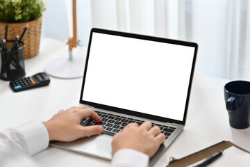 Closeup view unrecognizable businessman typing on laptop. Blank screen for your advertising text message
