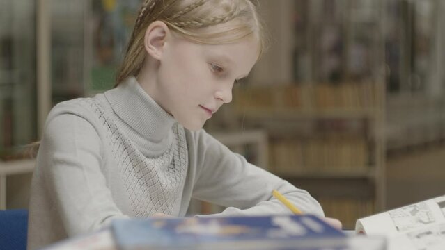 A Girl Learning in School Library, Child Reading Book, Kid, Teenager Schoolgirl Studying in Classroom, Children Education