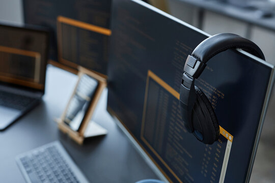 Desktop PC with wireless headphones at desk