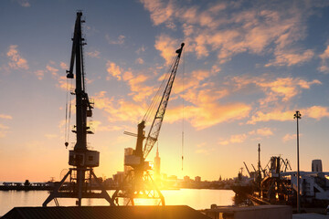 Large cranes for unloading or loading in the port. Empty port without ships.