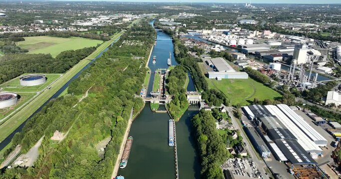 Aerial drone view a inland shipping sluice over the rhine herne canal in Germany.