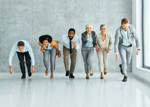 young business people meeting office teamwork group fun competition sports race break speed winner victory finish colleague win success  run runner businesswoman senior mature