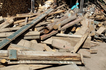 A bunch of old logs lie like trash.