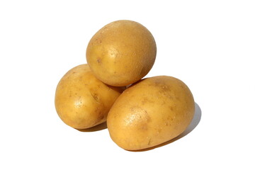 Three potatoes lie on a white background.
