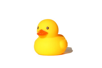 A yellow toy duck stands on a white background.

