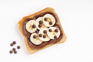 Sweet toast with chocolate butter and bananas. Flatly, copyspace.