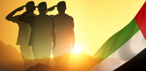 Silhouette Of A Solider Saluting Against the flag of UAE. Concept of national Muslim holidays....