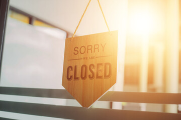Vintage sorry we are closed at the door of a coffee shop, restaurant, shop, during the outbreak of...