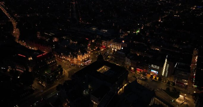 Aerial drone view of the Leidseplein, Amsterdam, entertainment area in the city of Amsterdam, clubs, cafes, restaurant, theather and shops at night.