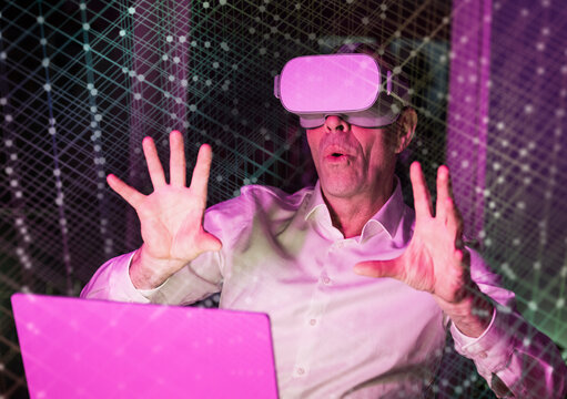 Businessman using virtual reality simulator with graphical user interface
