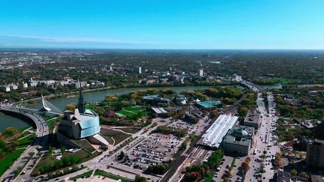 Establishing Shot Fall Seson Drone Aerial Cinematic Shot Fall Downtown Winnipeg Landscape Sky Horizon with VIA Rail Canadian Museum for Human Rights Provencher Bridge The Forks Market Manitoba Canada