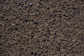 Black asphalt texture. asphalt road. stone asphalt texture background black granite gravel. Asphalt with granite crushed stone.
