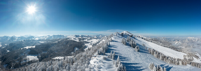 Austria, Salzburger Land, Saint Gilgen, Drone panorama of snowcapped Zwolferhorn mountain and surrounding landscape