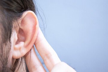 man touching his ear. hearing problem, hearing loss concept. - obrazy, fototapety, plakaty
