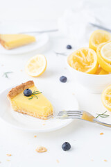Pastries with lemon cream and blueberries on a white background. Lemon blueberry pie. 