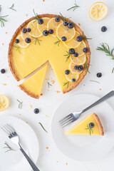Pastries with lemon cream and blueberries on a white background. Lemon blueberry pie. 