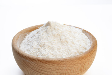 durum wheat flour inside a wooden bowl on a white background