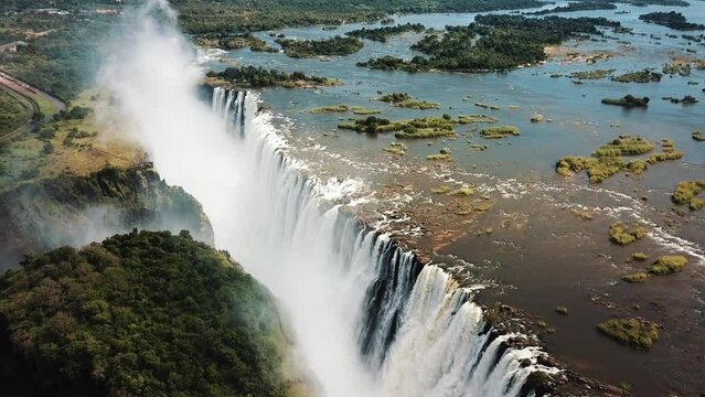 Aerial View Victoria Falls, Shungu Namutitima at the Border of Zimbabwe and Zambia in Africa. The Great Victoria Falls One of the Most Beautiful Wonders of the World. 4K UHD Aerial Dron Shot.