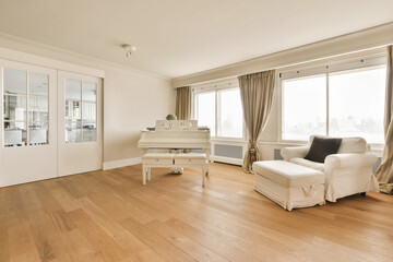Living room with grand piano and large chair at home