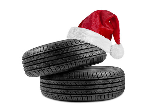 a black isolation rubber tire, with a Santa Claus hat for Christmas on a transparent background in PNG format - Powered by Adobe